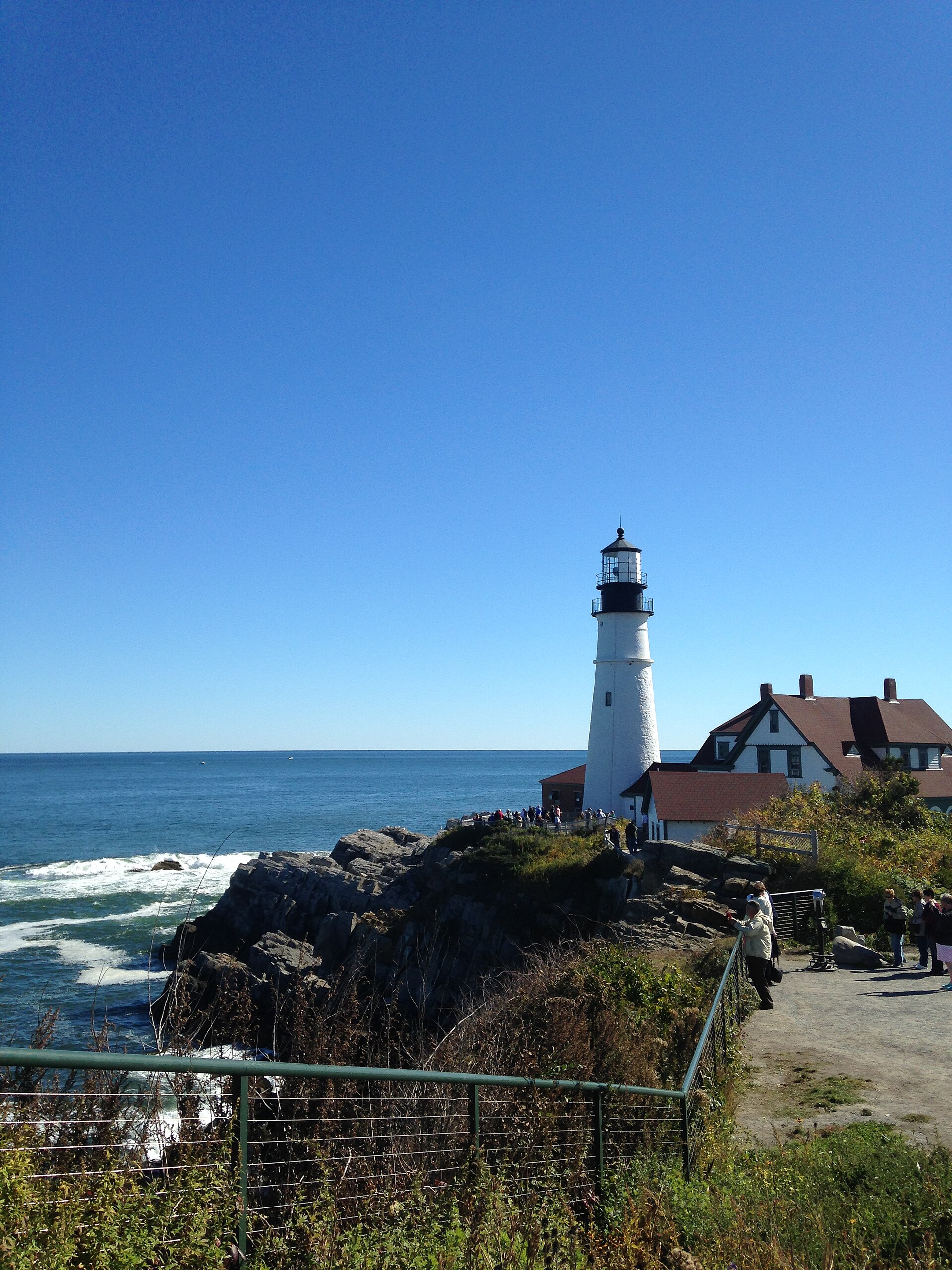 Maine lighthouse cliff sea